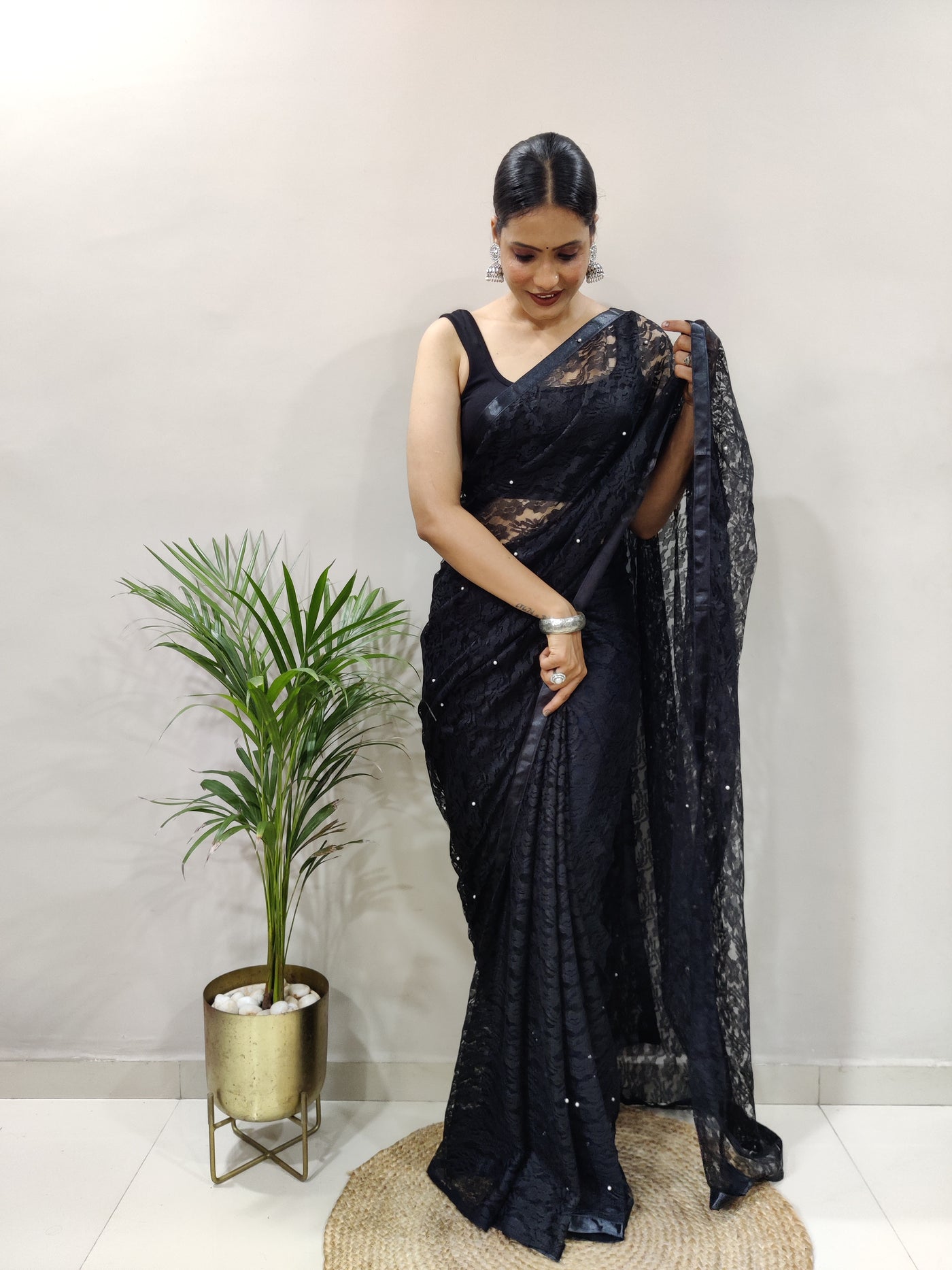 Beautiful Black Net Brasso Saree With Running Net Blouse